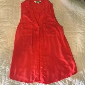 Sleeveless shirt. Bright coral color.